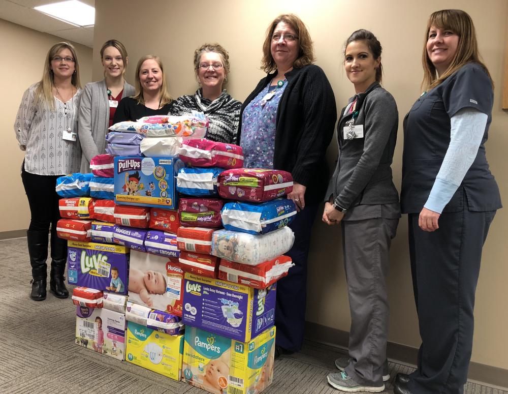 The Pines Team celebrates a very successful diaper drive